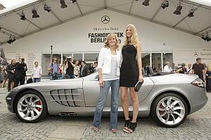 Susie Stoddart and Julia Stegner with the SLR Roadster at the Mercedes-Benz Fashion Week Berlin venue